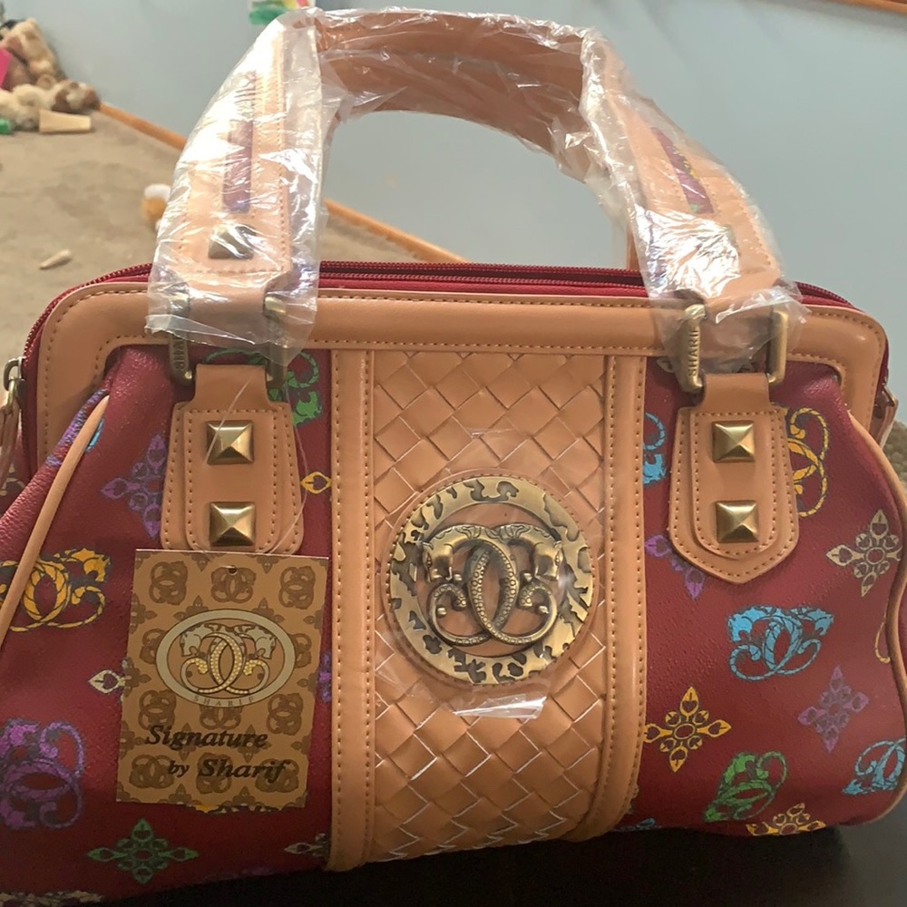 Brand new still in plastic Signature by Sharif red bag. 3 pace set.